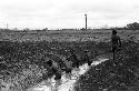 Men working on irrigation ditch