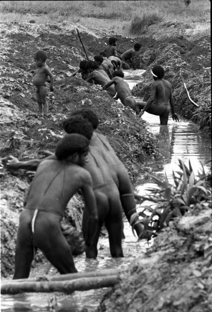 Men building irrigation ditches