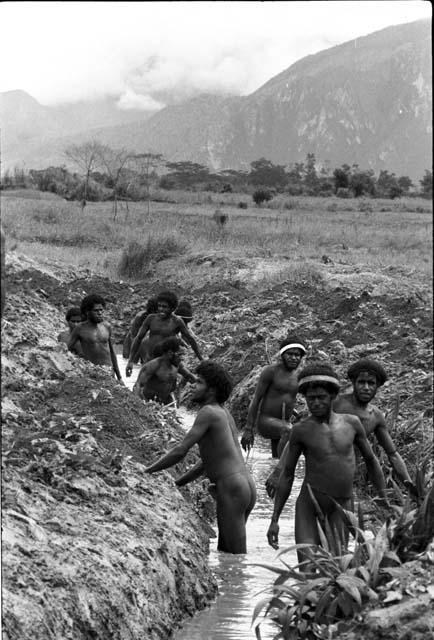 Men working in ditch