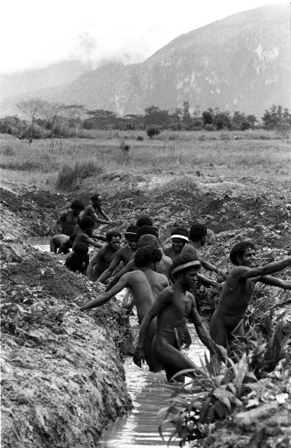 Men working in ditch