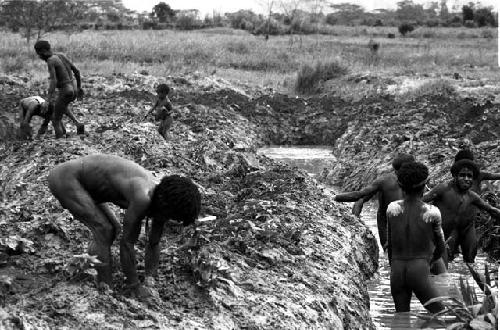 Men working in ditch