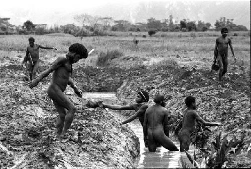 Men working in ditch