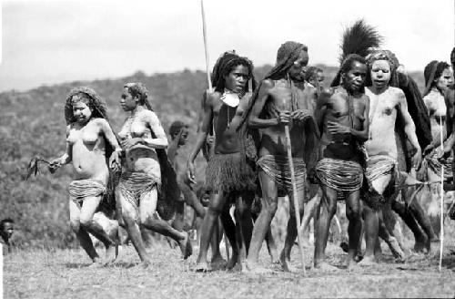Women dancing and running in formation