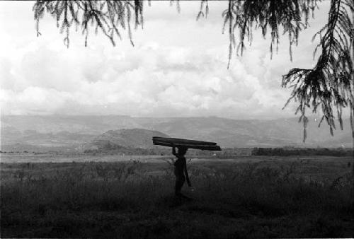 Woman carrying wood on the salt trail