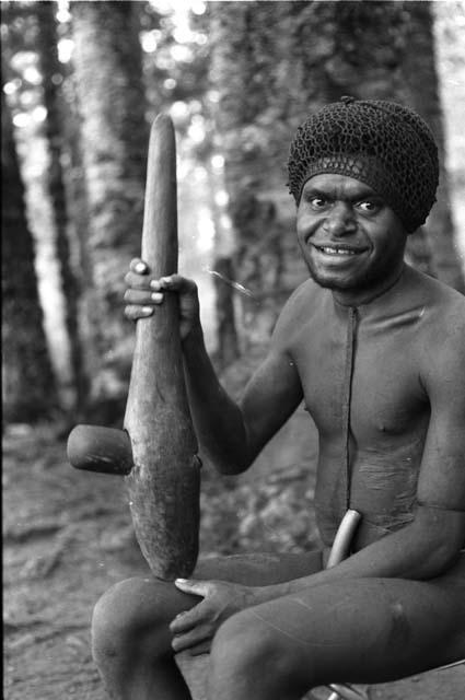 Man sitting with axe