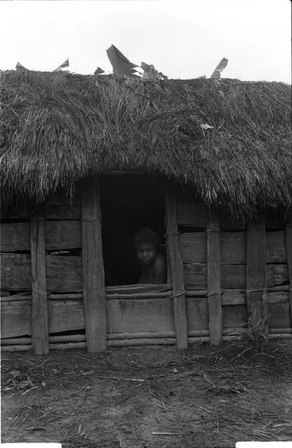 Woman in doorway of hunu