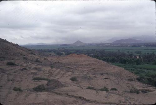 Burned area at Falda de Cerro Orejas (K3955) as seen from the East; an up-valley Chimu site with adobe platforms