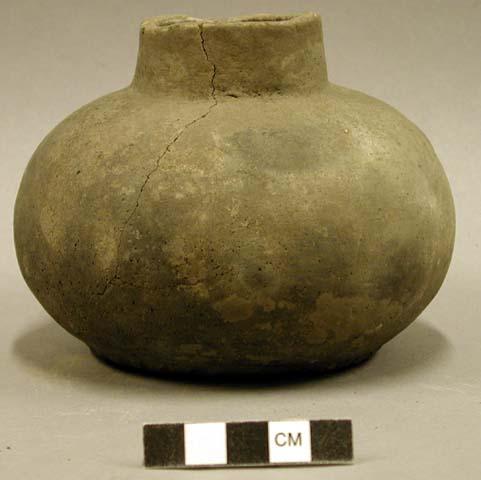 Ceramic vessel, serrated around base, sherds inside