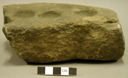 Ground stone, several large punctates