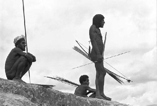 Man standing with bow and arrows