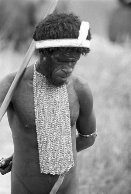 Man standing with bow