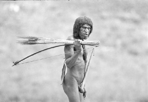 Man carrying bow and arrows