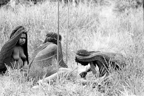 Women sitting in grass