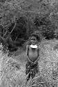 Child standing in grass