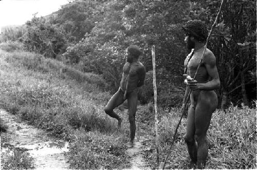 Milika and another man outside on the salt trail