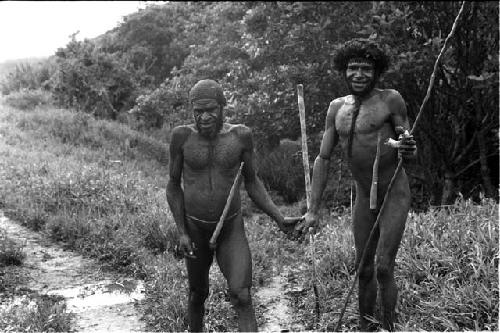 Milika and another man outside on the salt trail