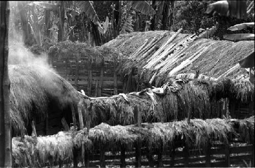 Woman drying out salt-gathering materials