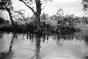 People on the shore of the Aikhé River