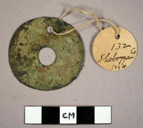 Metal, copper ornament, round with two holes