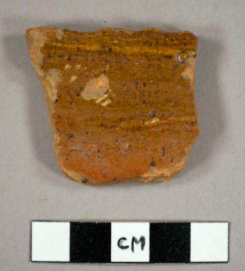 Body sherd, ochre glaze one side