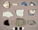 China sherds, some with transfer decoration; glass fragments (green, light blue-