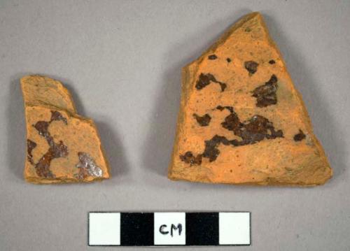 Body sherds. 0.375" thick. trace of lead glaze, one side.