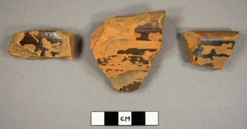 Rim sherds, orange paste. trace of brown glaze. 0.375" thick.