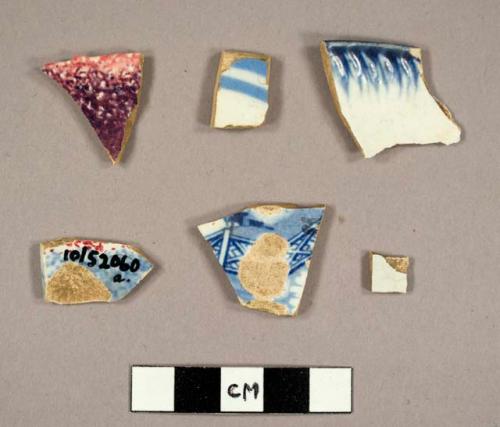 Potsherds, ranging in size from one-half square inch to 2 square inches, buff co