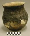 Corrugated pottery jar, restorable