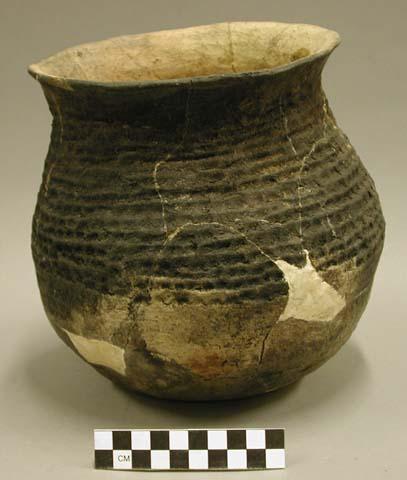 Corrugated pottery jar, restorable