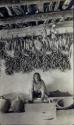 Hopi woman grinding corn