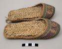 Pair of woven shoes with purple and green design