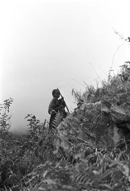 Child sitting on figure's shoulders