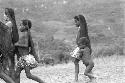 Small group of women and children dancing