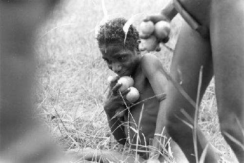 Little boys grabbing cucumbers