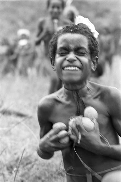 Uwar with a handful of cucumbers