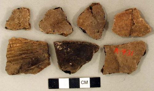 Coarse earthenware body sherds, some cord impressed