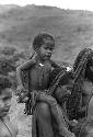 Woman carrying child on her shoulders