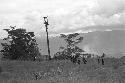 Puakoloba on the day of an Etai before the men have gone over to the Liberek; distance shot of the Etai; many spears over an oléa; men in the kaio