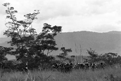 Group of men down the Aikhe who will go over to the kaio at Puakoloba