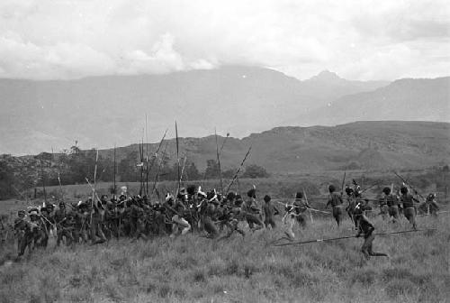 Men dancing from Puakoloba towards the Anelerak