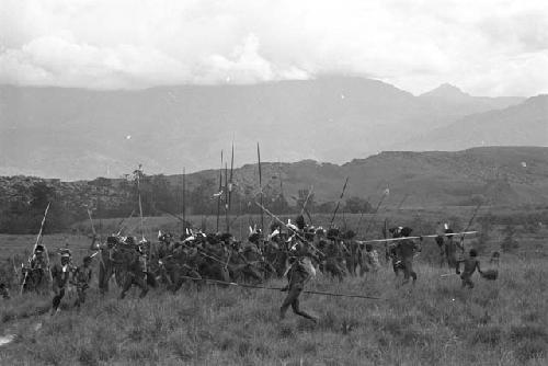 Men dancing from Puakoloba towards the Anelerak