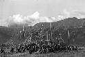 Group of men in front of the oléa; NE mt. wall behind at Liberek during an Etai