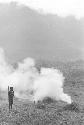 Man burning trash in his field