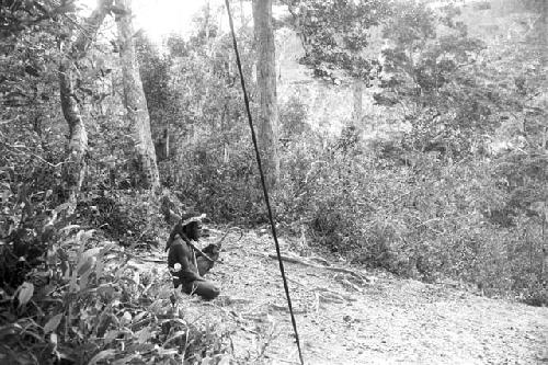 Man sitting in forest