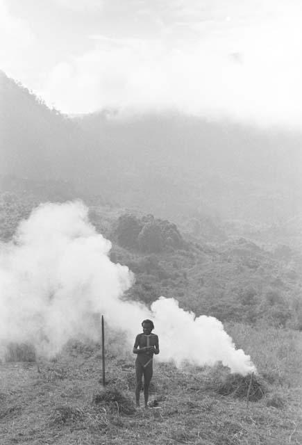 Man burning trash in his field