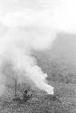 Man burning trash in his field