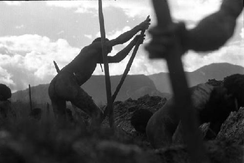 men working in a ditch