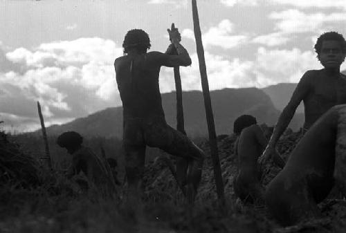 men working in a ditch