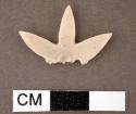 Shell, carved star or flower shape, broken, three lobes with partial center perf